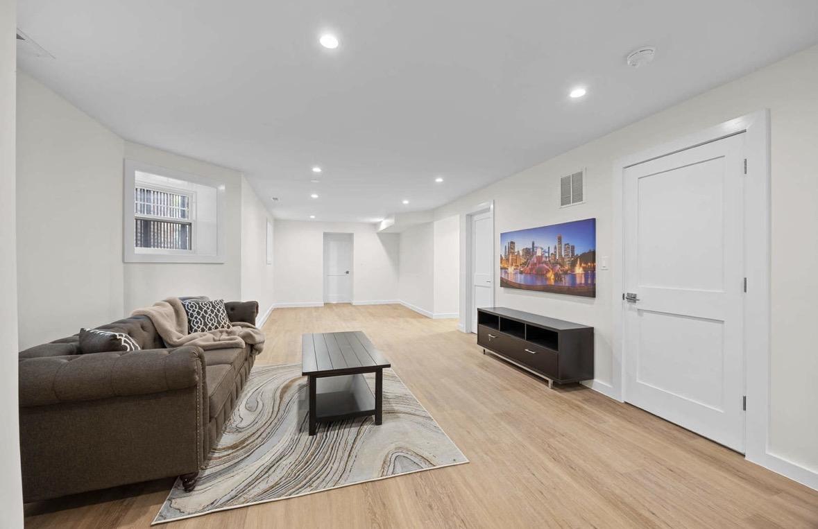 Basement living area with entertainment setup