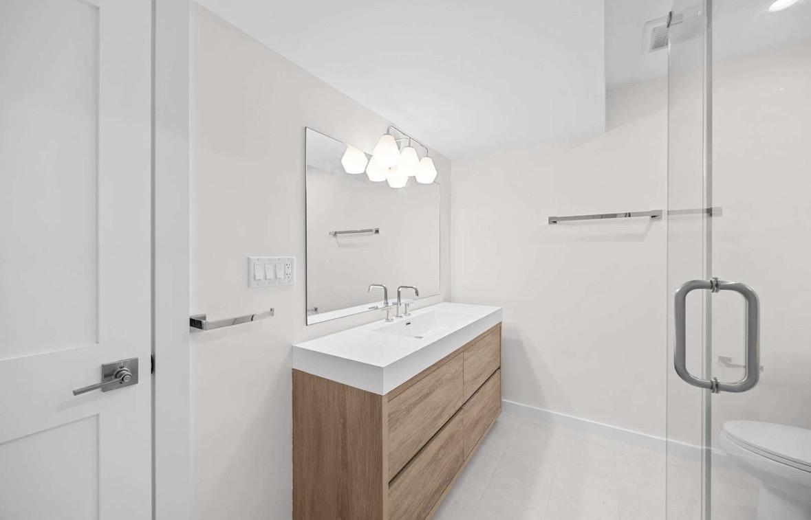 Modern bathroom with geometric vanity light